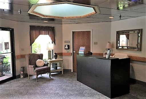 A cozy and inviting office reception area with a comfortable chair and modern decor.