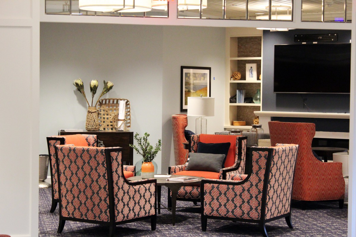 A stylish living room with patterned chairs and modern decor.