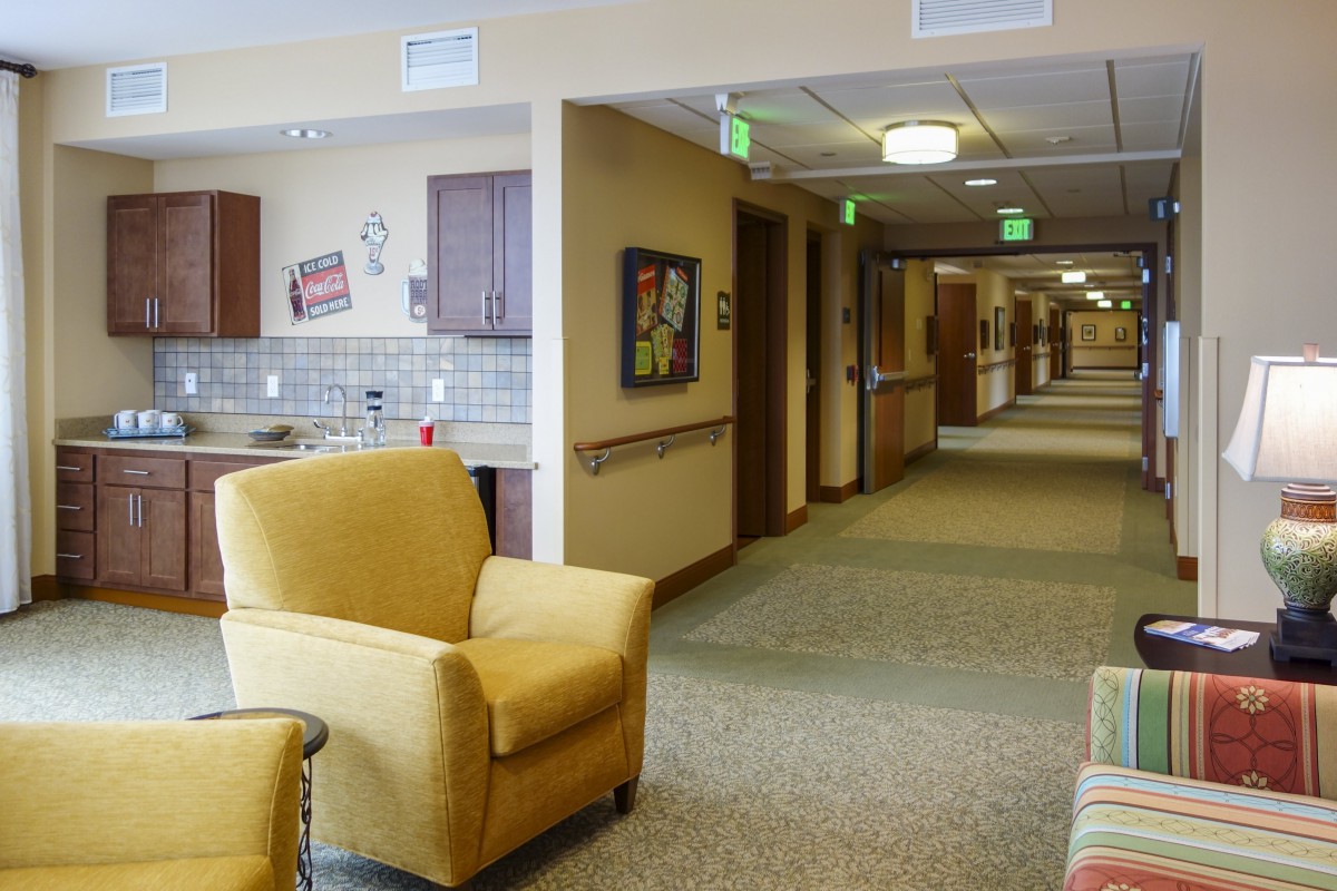 A cozy hallway with comfortable seating and warm lighting.
