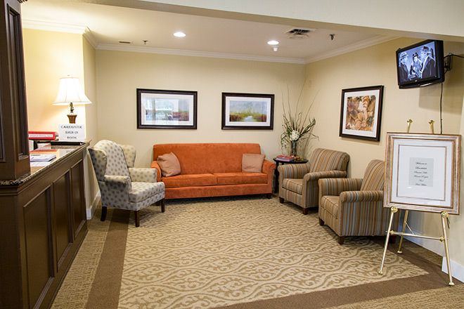 A well-appointed waiting room featuring comfortable seating and tasteful decor.