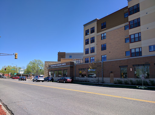 A modern hospital building captured on a clear day.