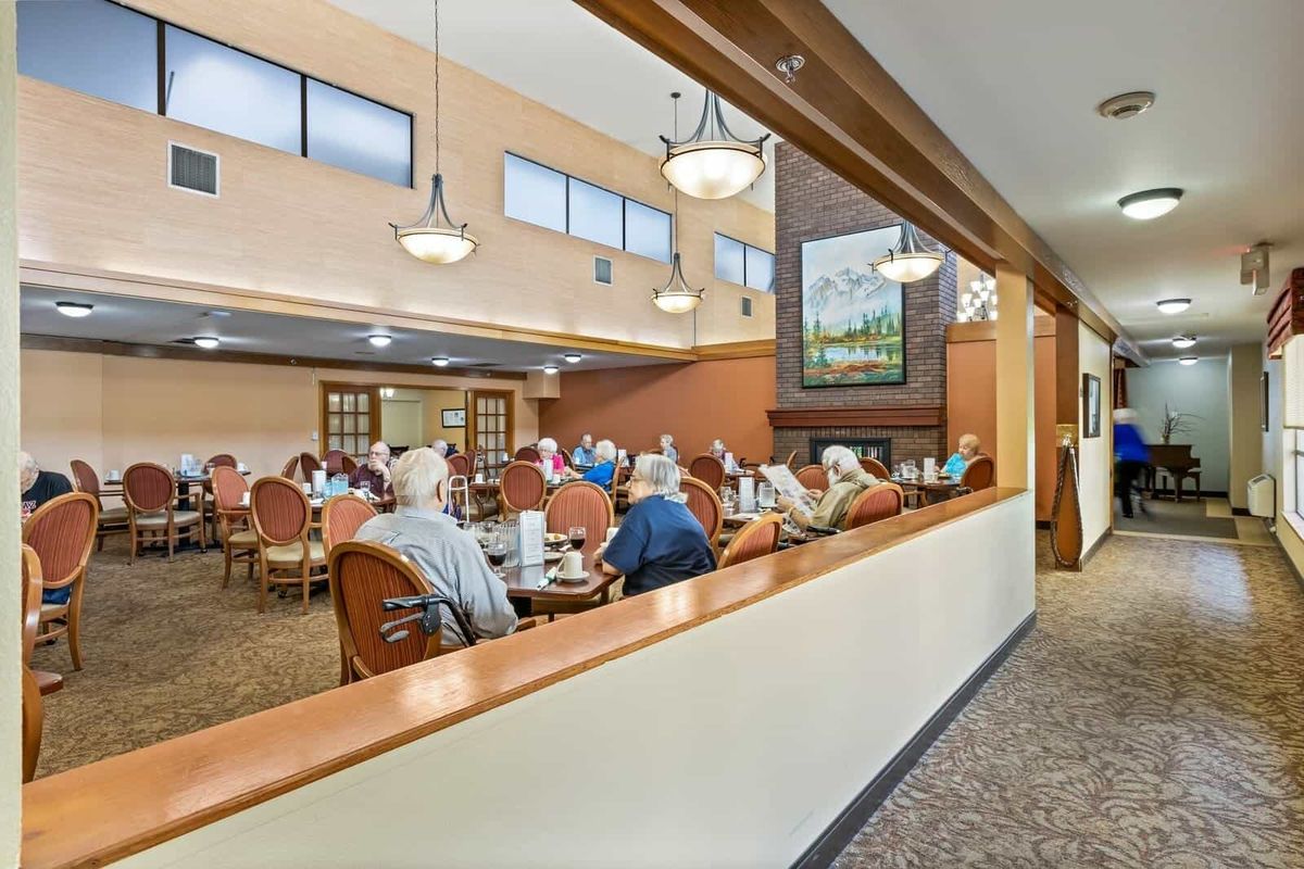 A spacious dining area filled with people enjoying a meal together.