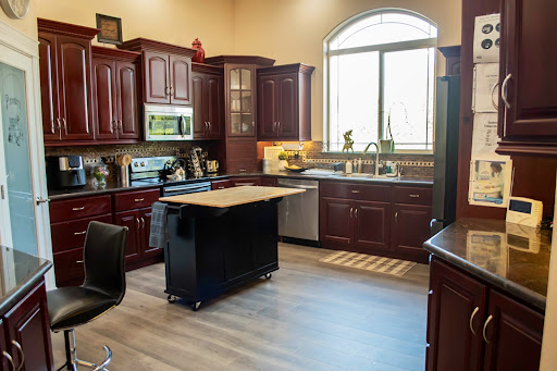 A beautifully designed modern kitchen featuring rich wooden cabinets and ample natural light.