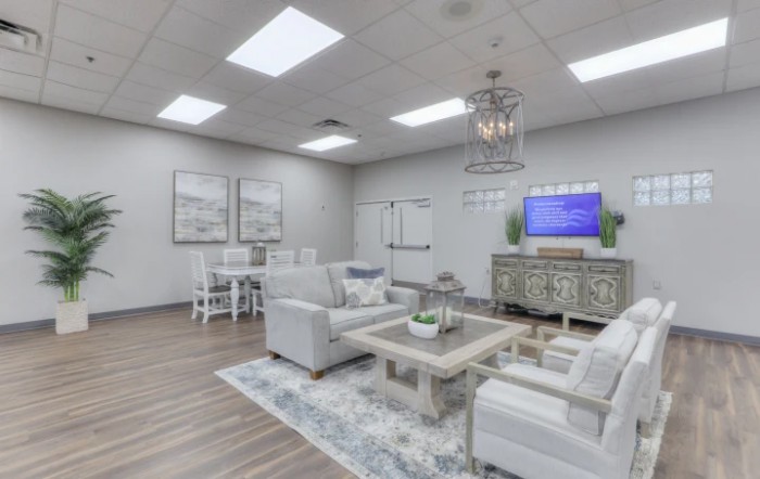 A modern living room with comfortable seating and elegant decor.
