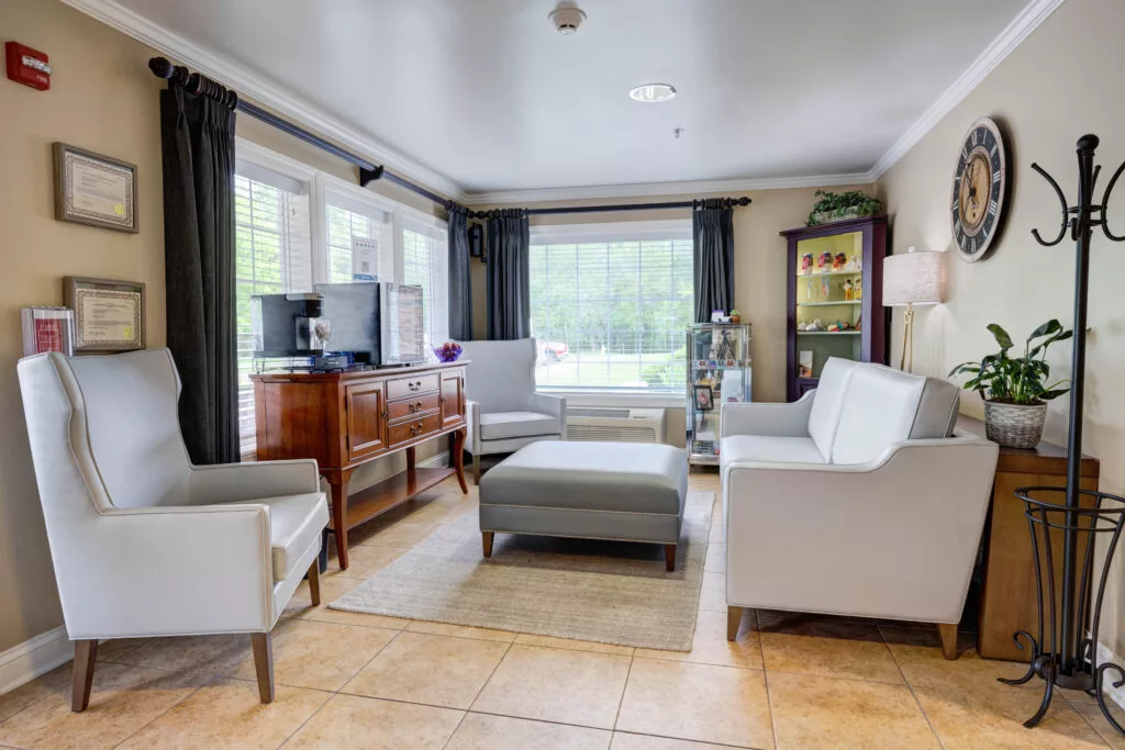 A modern living room with comfortable seating and ample natural light.