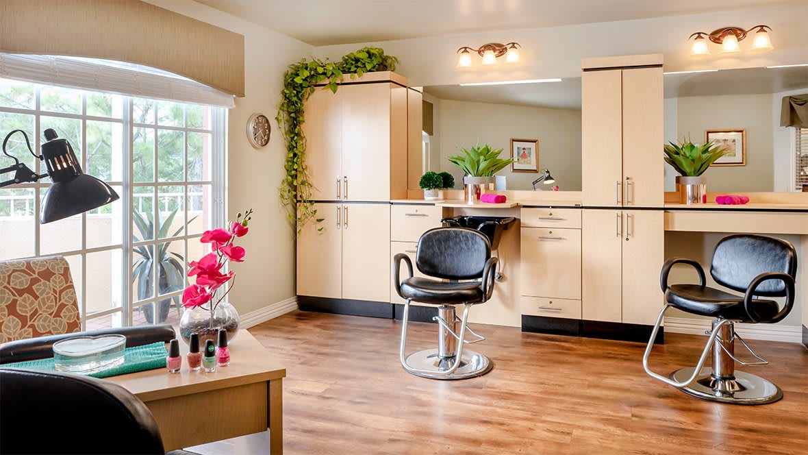 Modern hair salon interior with stylish furniture and bright decor.