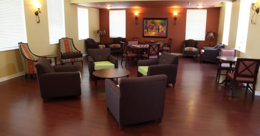 A cozy lounge area with modern furniture and warm lighting.