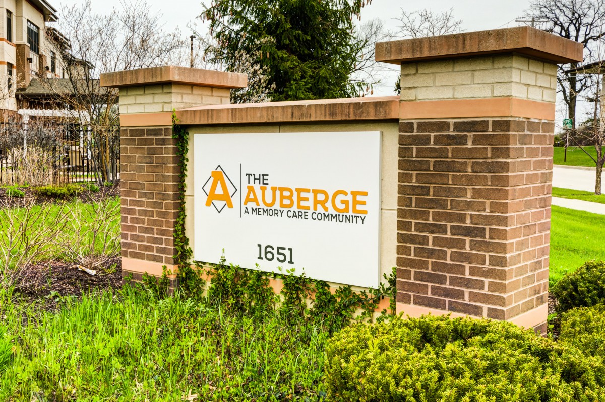 Entrance sign for The Auberge Onion Creek Community.