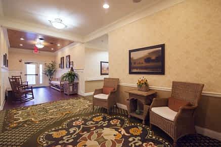 A cozy hallway with chairs and decorative elements.