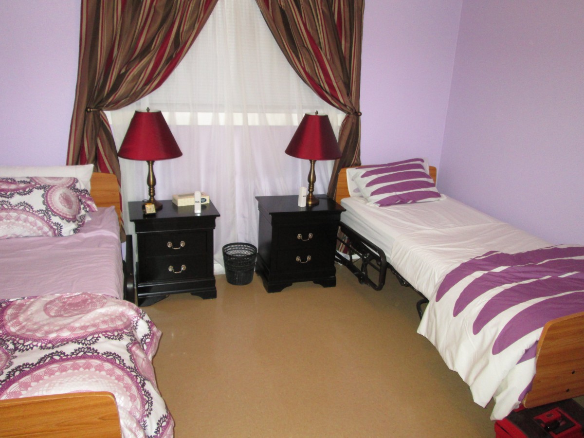 A cozy bedroom with twin beds and matching decor.