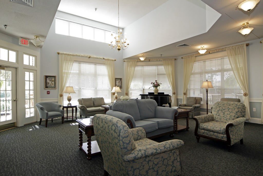 A spacious living room with comfortable seating and ample natural light.