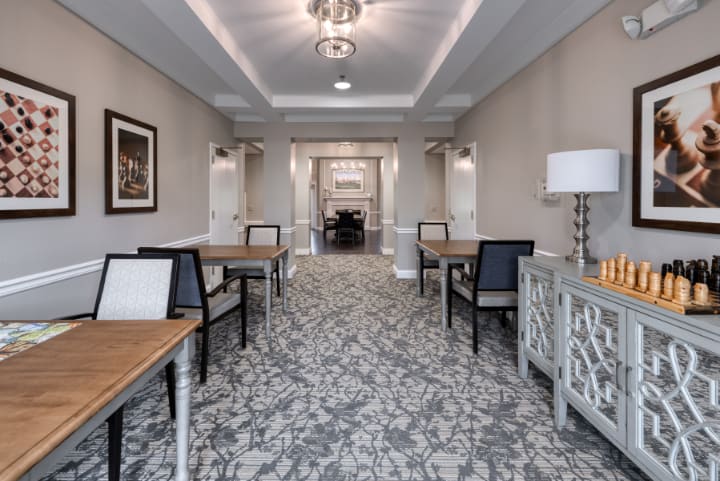 A modern hallway with elegant furnishings and contemporary lighting.