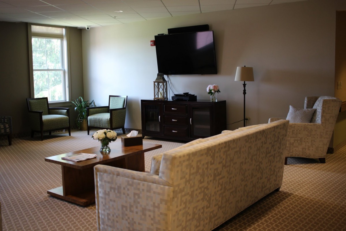 A modern living room with a comfortable sofa, coffee table, and television.