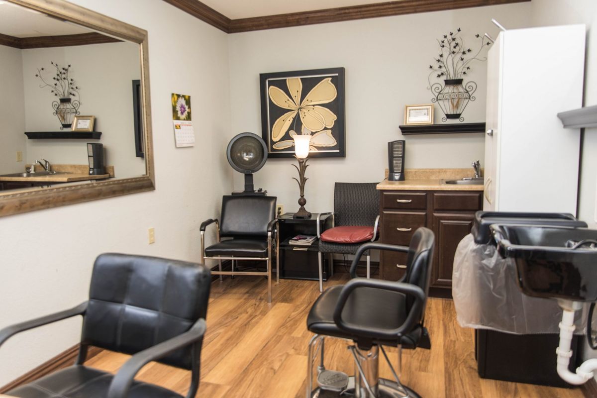 A cozy hair salon with stylish interiors and comfortable seating.