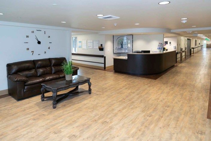 A modern reception area with a sleek desk and comfortable seating.