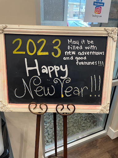 A cheerful New Year greeting celebrating the arrival of 2023 with wishes for new adventures and good fortunes.