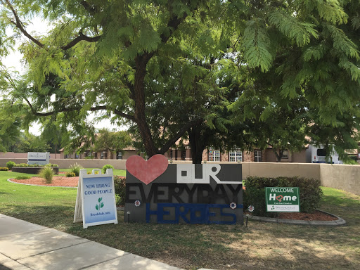 A colorful display celebrating 'Everyday Heroes' in a community setting.