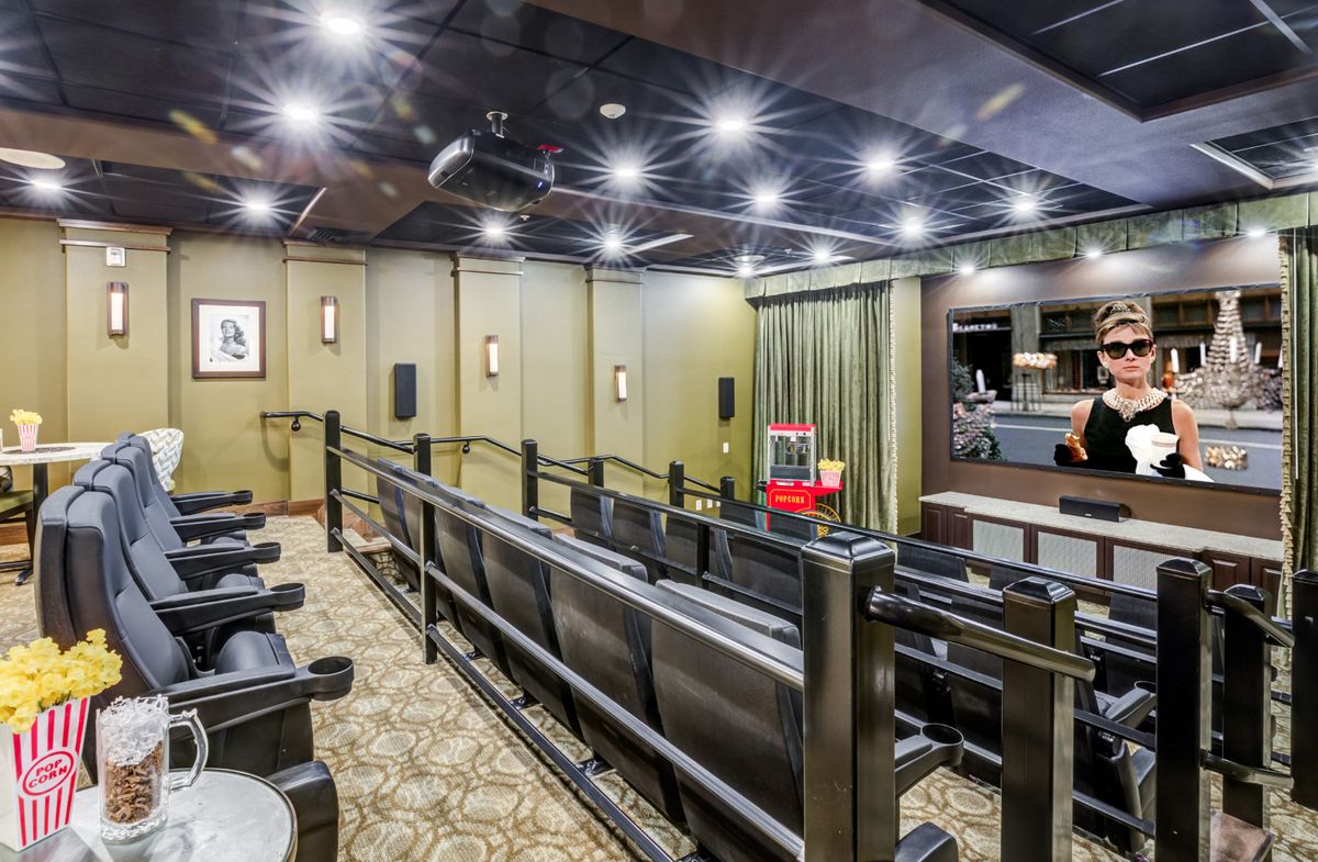 Spacious home theater with comfortable seating and ambient lighting.