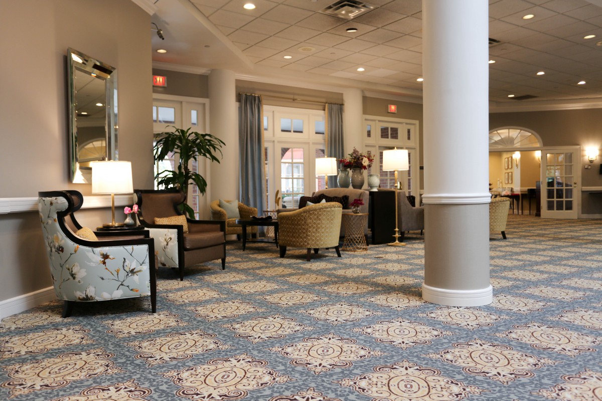 A cozy and elegantly furnished lobby with comfortable seating and warm lighting.