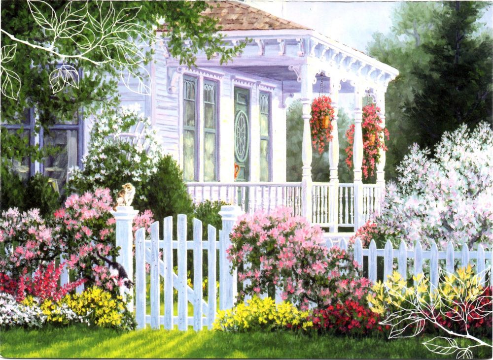A charming house with a white picket fence and a vibrant garden in full bloom.