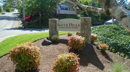 Entrance sign for South Hills Residential Community, surrounded by greenery.