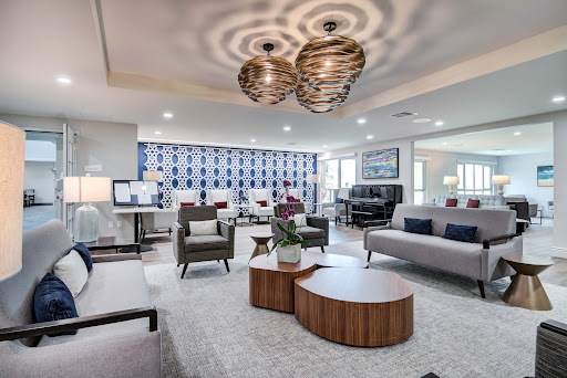 A stylish and modern living room featuring elegant furniture and contemporary lighting.
