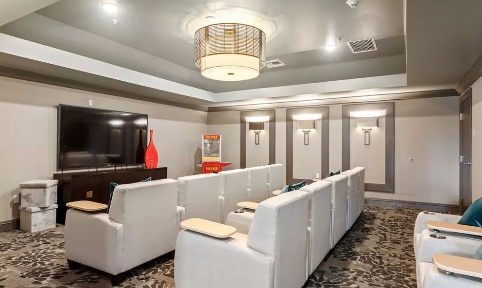 A modern home theater with comfortable seating and ambient lighting.