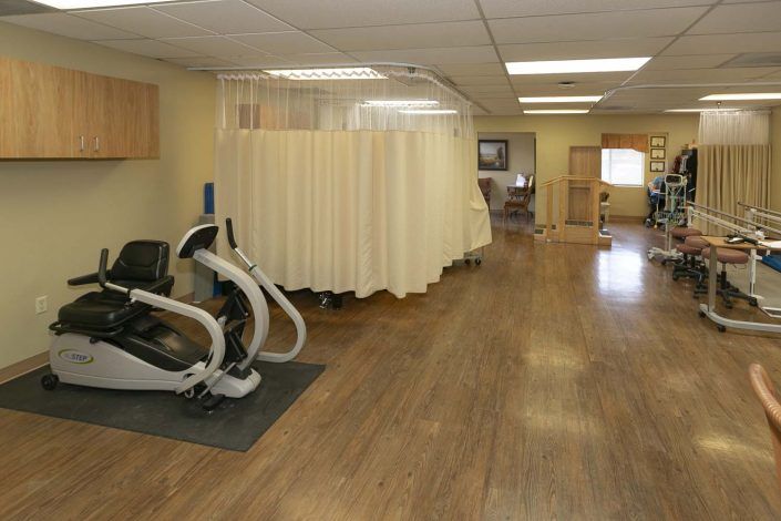A rehabilitation center with exercise equipment and therapy spaces.