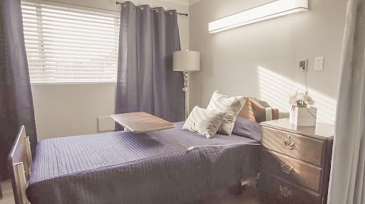A serene and modern bedroom featuring soft lighting and inviting decor.