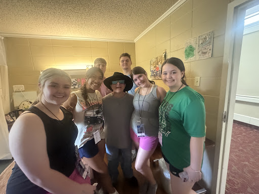 A cheerful group of friends enjoying a moment together indoors.