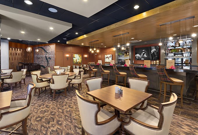 Elegant restaurant interior with comfortable seating and warm lighting.