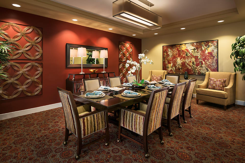 A luxurious dining room with an elegant table setting and sophisticated decor.