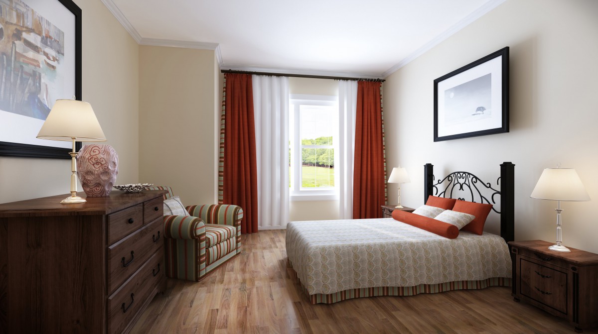 A cozy bedroom with a bed, armchair, and dresser, featuring red and white curtains.