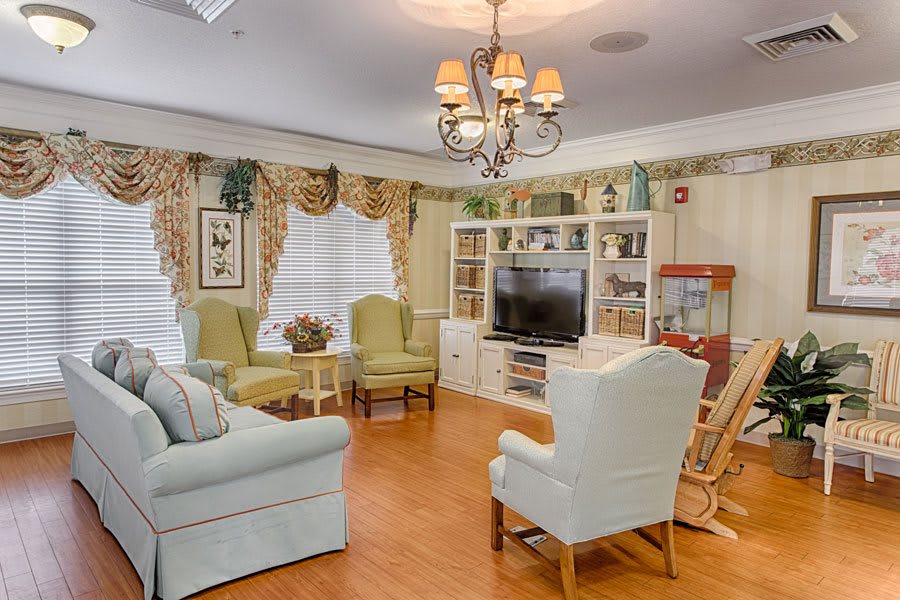 A cozy living room with elegant furniture and warm lighting.