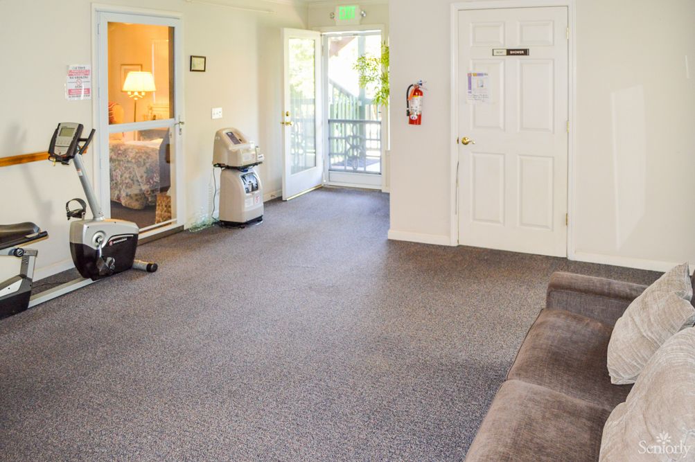 A spacious and bright lobby area with an open door letting in natural light.