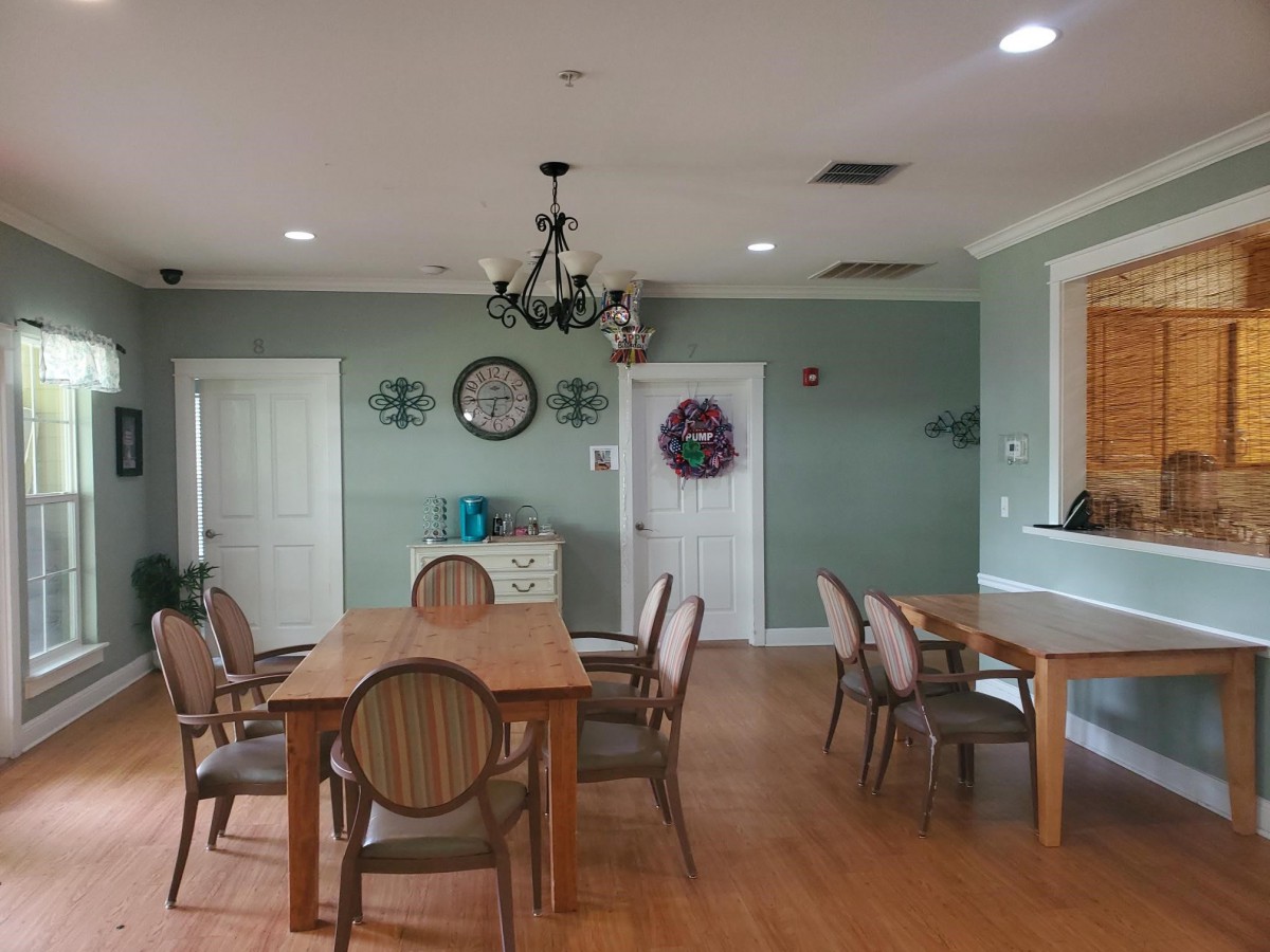 A cozy dining room with wooden furniture and elegant decor.