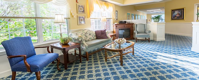 A cozy living room with antique furniture and elegant decor.