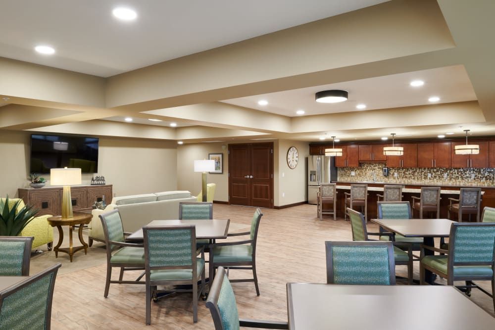 A modern kitchen and dining area with contemporary furniture and lighting.