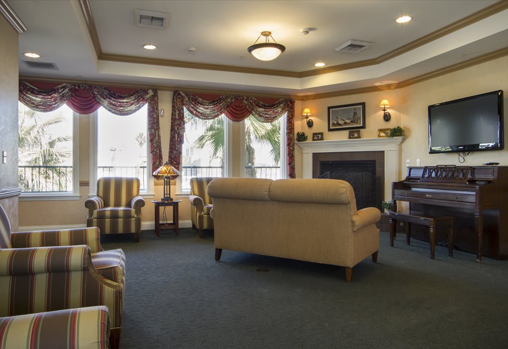 A cozy living room with elegant furniture and a fireplace.