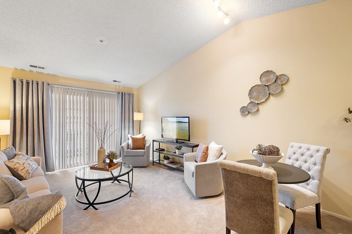 A cozy and modern living room with comfortable seating and stylish decor.