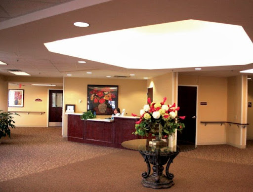 A welcoming reception area with stylish furniture and floral arrangements.