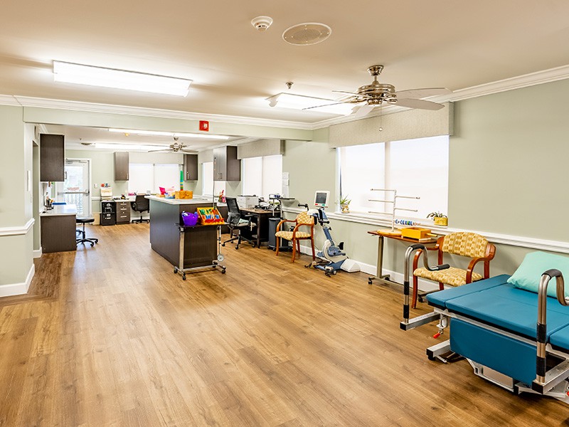 A well-organized rehabilitation center room equipped for physical therapy.