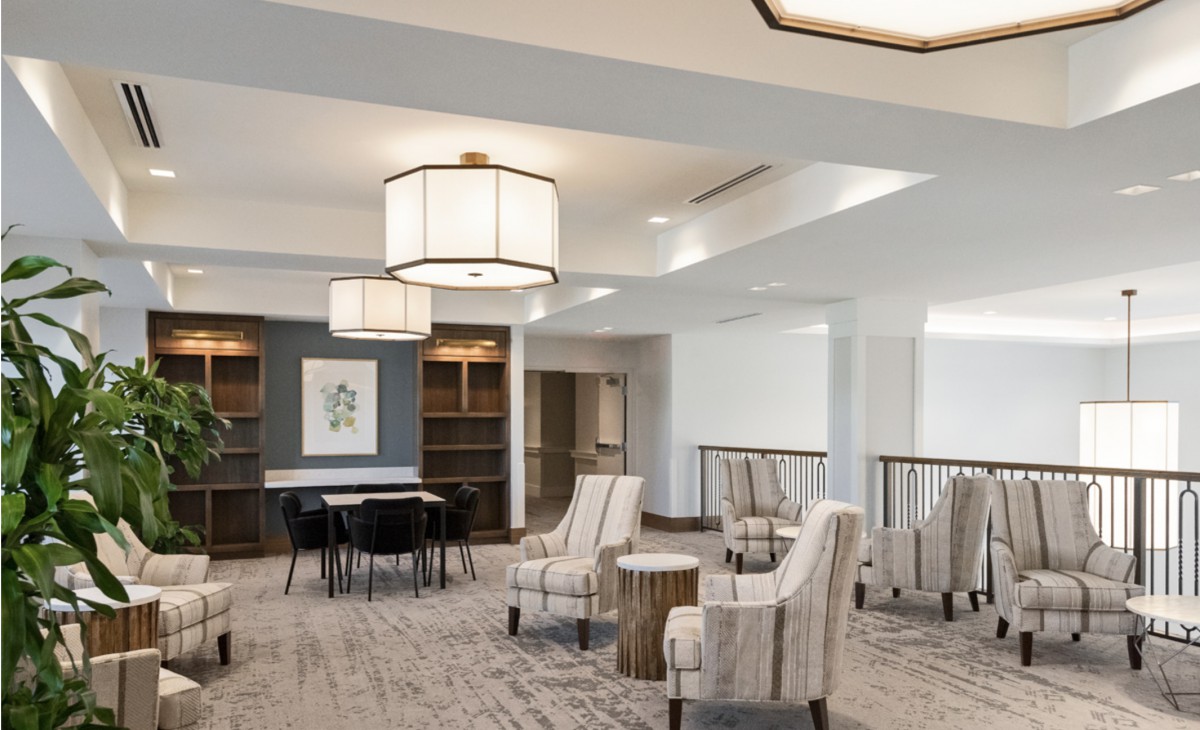 A modern lobby with comfortable seating and stylish lighting fixtures.