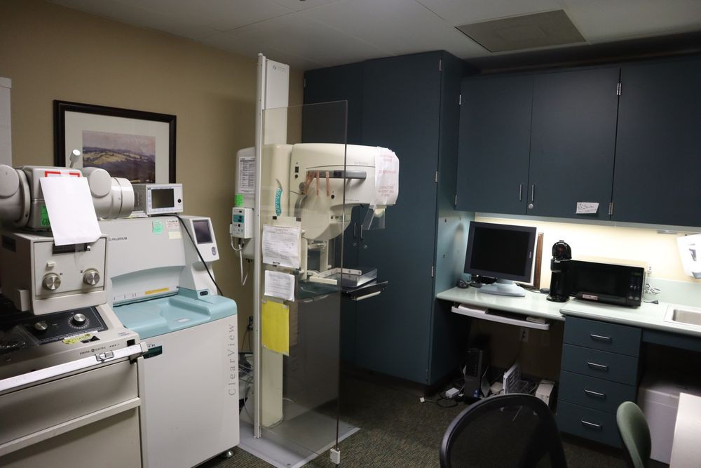 A medical office featuring a mammography machine and diagnostic equipment.