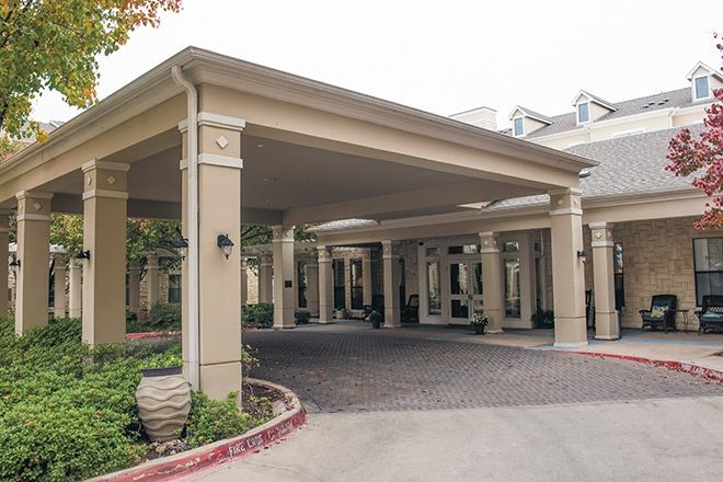 An exterior entrance with a covered canopy at a building.