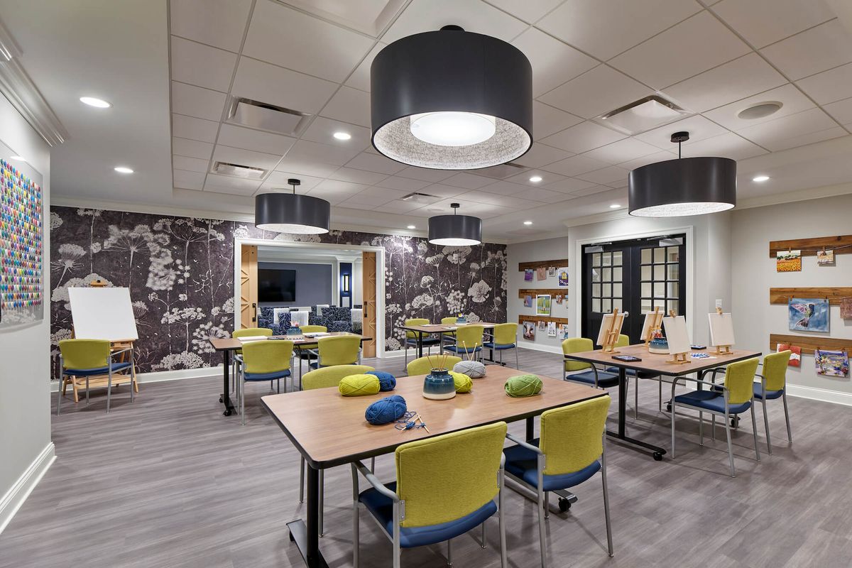 A modern conference room with stylish furniture and lighting.