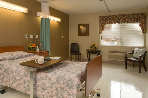 A cozy hospital room equipped for patient care.
