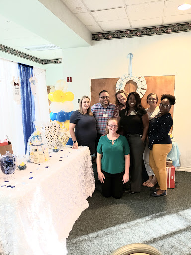 A joyful gathering celebrating a special occasion with friends and decorations.