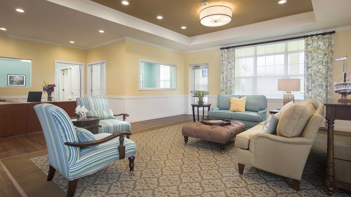 A modern and comfortable living room with stylish furniture and warm lighting.