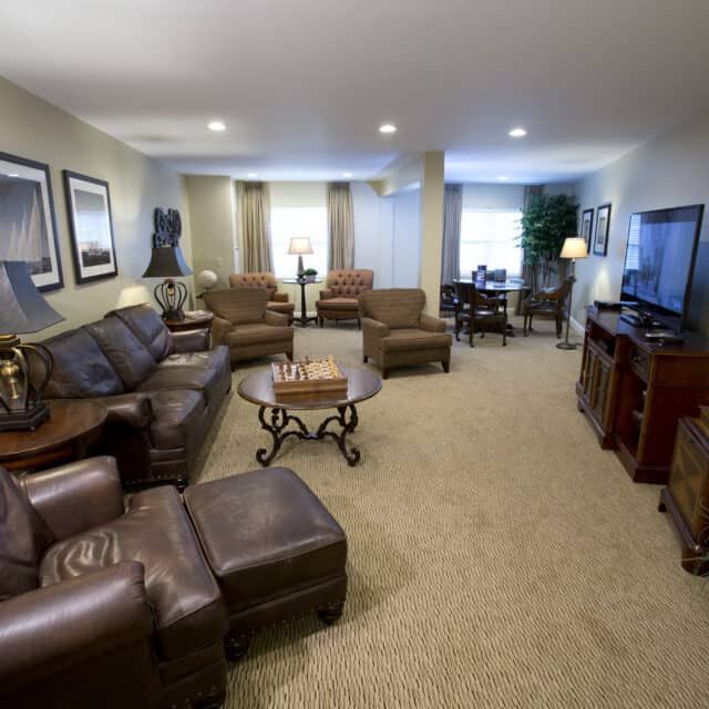 A cozy and spacious living room with elegant furniture and decor.